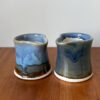 modern cream pitcher in two different glazes