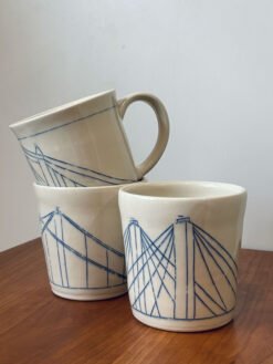 Wheel thrown pottery mugs with bridge motif