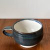 Pottery Tea Cup with Blue speckled exterior and white interior