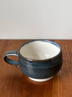 Pottery Tea Cup with Blue speckled exterior and white interior
