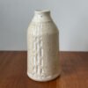 Wheel thrown bottle vase with carved design
