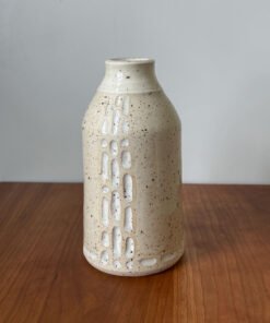 Wheel thrown bottle vase with carved design