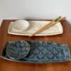 handmade pottery sushi set in cream and blue glaze