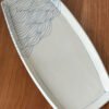 small pottery platter with wave pattern