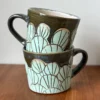 pottery mug with lily pad pattern
