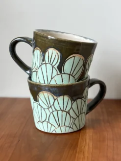 pottery mug with lily pad pattern